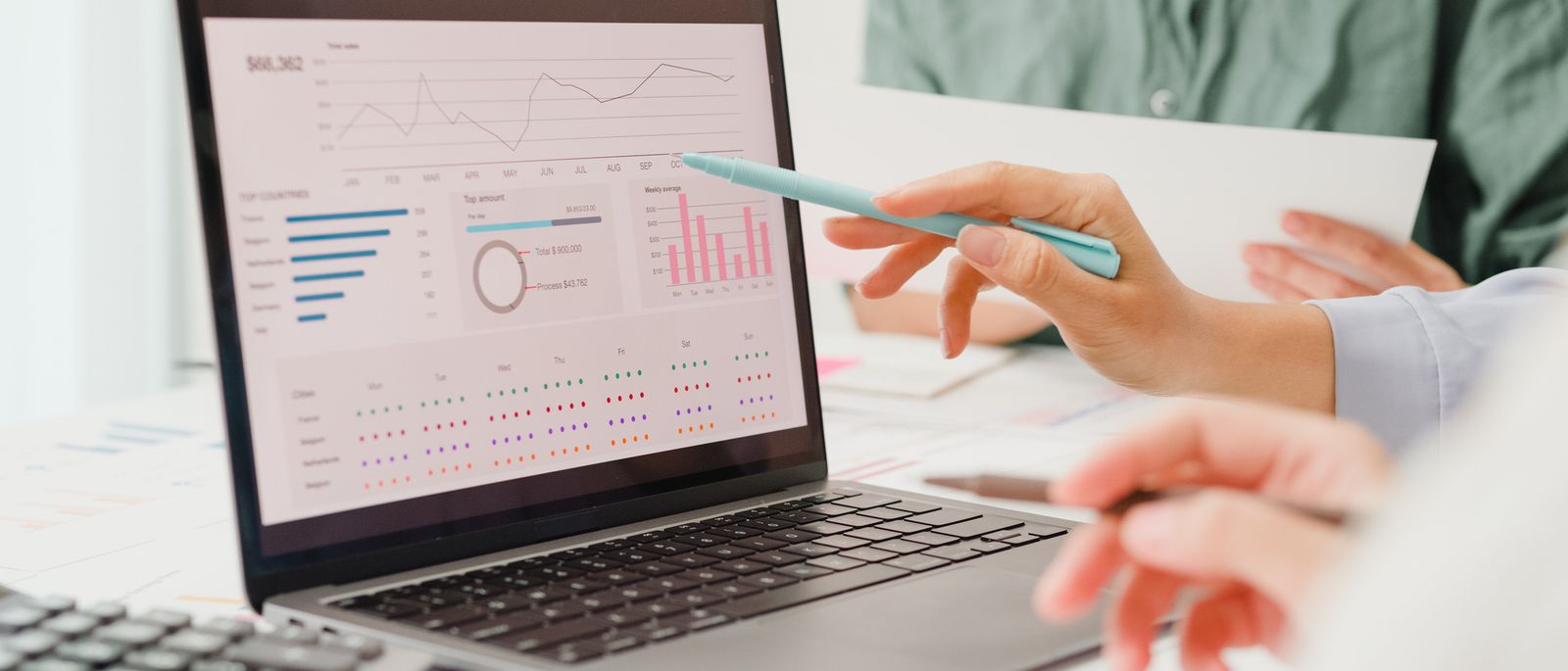 Reviewing financial performance charts on a laptop